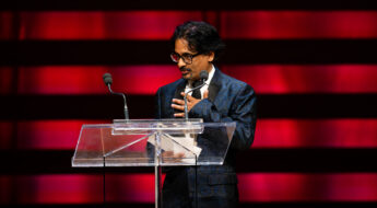 Faisal Lutchmedial behind the lectern the the WGC Awards 2025.